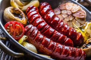 Roasted sausages with vegetable and draft beer. photo