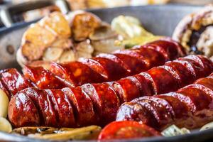 Roasted sausages with vegetable and draft beer. photo