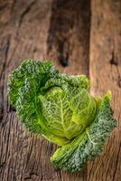 Fresh kale on rustic wooden table. photo