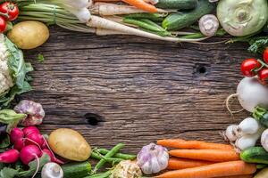 Assortment of fresh vegetables. Carrot garlic kohlrabi onion celery cucumber parsnip and radish on table. photo