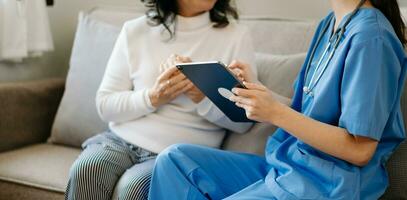 Asian female hands touching old female hand Helping hands take care of the elderly concept in  hospital photo