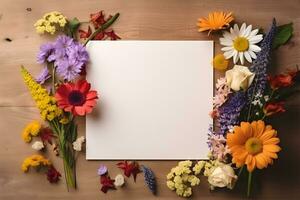 Blank greeting card mockup on wooden background with garden flowers. Summer flat lay composition. Top view with copy space. AI generated. photo