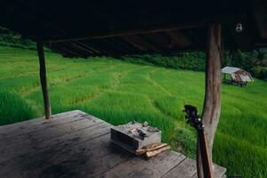 Rice fields and wooden hut balcony photo