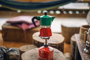 Moka pot coffee on a portable gas stove photo