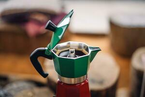 Moka pot coffee on a portable gas stove photo