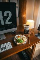 Coffee and breakfast on the desk photo