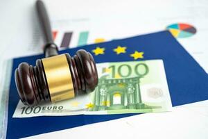 Gavel for judge lawyer and Euro dollar banknotes on EU flag, finance concept. photo