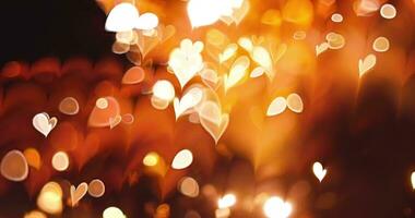 Glowing heart bokeh effect on black background. Romantic Abstract Motion Background. video