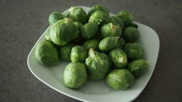 Fresh brussels sprouts in a box on a white background video