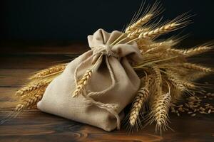 Sack of wheat and ears of wheat on a wooden table top. Quality products, healthy eating photo