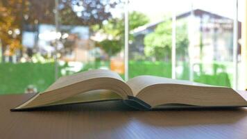 open book and a pencil on wooden table video