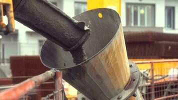 a bucket of concrete being poured into a bucket video