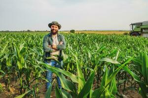 Portrait of farmer who is cultivating corn. Agricultural occupation. photo