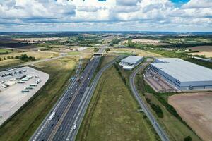 High Angle View of British Motorways and Highways and Traffic on M1 Junction 11a of Luton and Dunstable England UK. Image Was Captured on August 15th, 2023 photo
