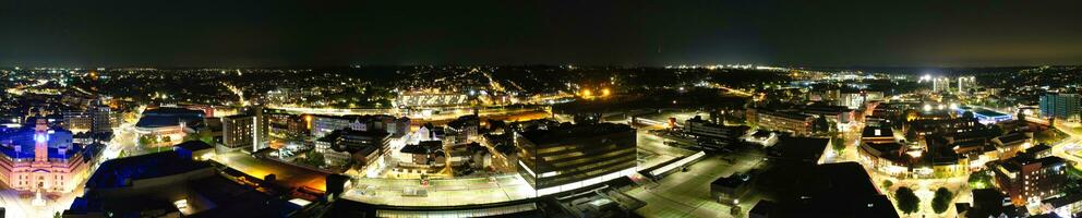 Ultra Wide Aerial Panoramic View of Illuminated Downtown Buildings, Roads and Central Luton City of England UK at Beginning of Clear Weather's Night of September 5th, 2023 photo