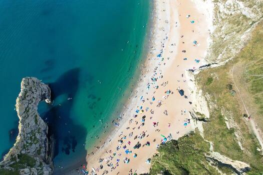 Most Beautiful High Angle View of British Landscape and Sea View of Durdle Door Beach of England Great Britain, UK. Image Was captured with Drone's camera on September 9th, 2023 photo