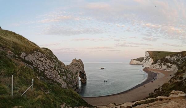 Most Beautiful High Angle View of British Landscape and Sea View of Durdle Door Beach of England Great Britain, UK. Image Was captured with Drone's camera on September 9th, 2023 photo