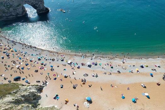 Most Beautiful High Angle View of British Landscape and Sea View of Durdle Door Beach of England Great Britain, UK. Image Was captured with Drone's camera on September 9th, 2023 photo