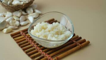 minced garlic in a bowl on table video