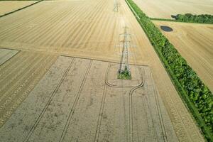 High Angle Panoramic Landscape View of British Agricultural Farms at Countryside Landscape of Sharpenhoe Clappers, Luton City of England UK. Footage Captured on August 19th, 2023 photo