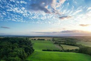 High Angle Landscape View of British Agricultural Farms at Countryside Landscape of Sharpenhoe Clappers, Luton City of England UK. Footage Captured on August 19th, 2023 photo