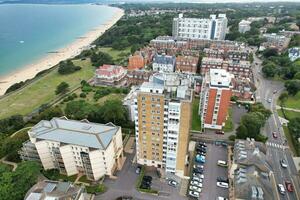 Ariel Footage of Attractive Tourist Destination at Bournemouth City Sandy Beach and Ocean of England Great Britain, Aerial Footage Captured with Drone's Camera on August 23rd, 2023 During sunny Day. photo