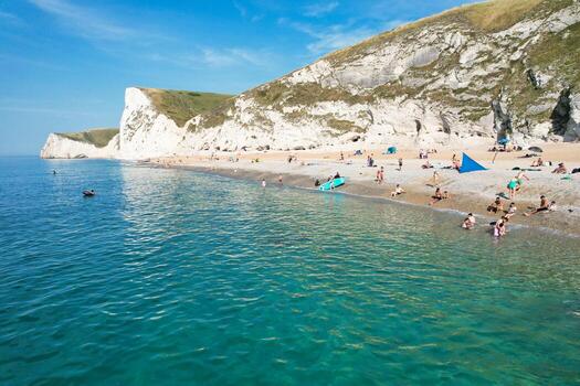 Most Beautiful High Angle View of British Landscape and Sea View of Durdle Door Beach of England Great Britain, UK. Image Was captured with Drone's camera on September 9th, 2023 photo