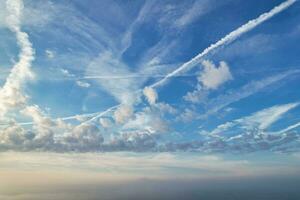 Most Beautiful and Best High Angle Dramatical Colourful Sky Footage from Above The Clouds. The Fast Moving Clouds During Sun rising Early in the Morning over Luton City of England UK photo