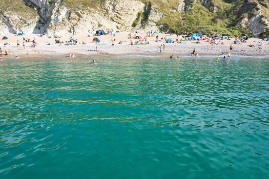 Most Beautiful High Angle View of British Landscape and Sea View of Durdle Door Beach of England Great Britain, UK. Image Was captured with Drone's camera on September 9th, 2023 photo