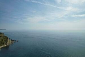 Most Beautiful View of British Landscape and Sea View of Durdle Door Beach of England Great Britain, UK. Image Was captured with Drone's camera on September 9th, 2023 photo