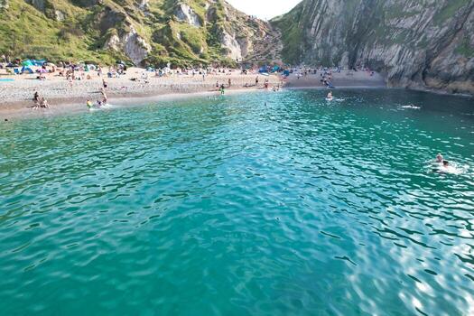 Most Beautiful High Angle View of British Landscape and Sea View of Durdle Door Beach of England Great Britain, UK. Image Was captured with Drone's camera on September 9th, 2023 photo