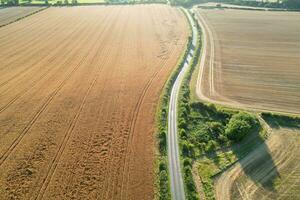 High Angle Footage of British Agricultural Farms at Countryside Landscape Nearby Luton City of England Great Britain of UK. Footage Was Captured with Drone's Camera on August 19th, 2023 photo