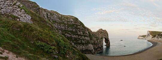 Most Beautiful High Angle View of British Landscape and Sea View of Durdle Door Beach of England Great Britain, UK. Image Was captured with Drone's camera on September 9th, 2023 photo