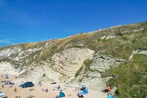 Best Aerial Footage of People are Enjoying Boat Ride at Gorgeous British Tourist Attraction and Ocean Sea View of Durdle Door Beach of England UK. Captured with Drone's Camera on September 9th, 2023 photo