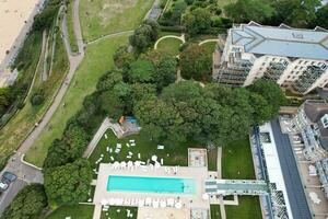 Ariel Footage of Attractive Tourist Destination at Bournemouth City Sandy Beach and Ocean of England Great Britain, Aerial Footage Captured with Drone's Camera on August 23rd, 2023 During sunny Day. photo