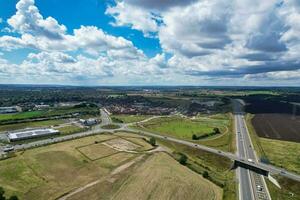 High Angle View of British Motorways and Highways and Traffic on M1 Junction 11a of Luton and Dunstable England UK. Image Was Captured on August 15th, 2023 photo