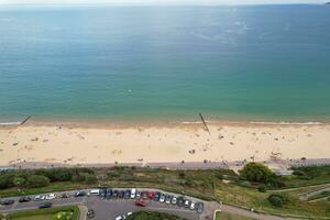 Ariel Footage of Attractive Tourist Destination at Bournemouth City Sandy Beach and Ocean of England Great Britain, Aerial Footage Captured with Drone's Camera on August 23rd, 2023 During sunny Day. photo