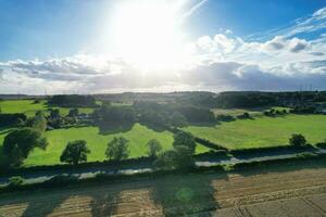 High Angle Footage of British Agricultural Farms at Countryside Landscape Nearby Luton City of England Great Britain of UK. Footage Was Captured with Drone's Camera on August 19th, 2023 photo