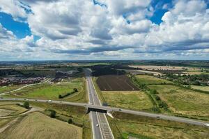 High Angle View of British Motorways and Highways and Traffic on M1 Junction 11a of Luton and Dunstable England UK. Image Was Captured on August 15th, 2023 photo