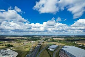 High Angle View of British Motorways and Highways and Traffic on M1 Junction 11a of Luton and Dunstable England UK. Image Was Captured on August 15th, 2023 photo