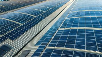 Large solar panels on roofs of industrial units and warehouses photo