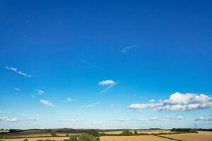 High Angle Footage of Most Beautiful Natural Orange Sunset with Orange Clouds and Sky over Luton City of England UK. Image Was Captured with drone's Camera on August 19th, 2023 photo