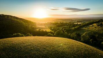 View of sunset from top of the hill in summer. photo