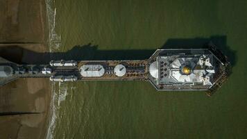 Aerial image of Eastbourne pier in early evening taken by a drone, East Sussex, UK photo