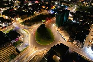 Aerial View of Illuminated Downtown Buildings, Roads and Central Luton City of England UK at Beginning of Clear Weather Night of September 5th, 2023 photo