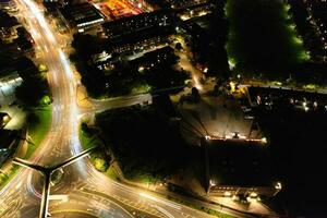 Aerial View of Illuminated Downtown Buildings, Roads and Central Luton City of England UK at Beginning of Clear Weather Night of September 5th, 2023 photo