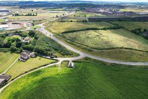 High Angle View of British Motorways and Highways and Traffic on M1 Junction 11a of Luton and Dunstable England UK. Image Was Captured on August 15th, 2023 photo