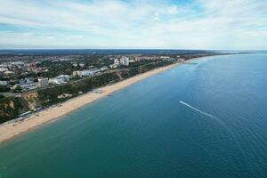 Ariel Footage of Attractive Tourist Destination at Bournemouth City Sandy Beach and Ocean of England Great Britain, Aerial Footage Captured with Drone's Camera on August 23rd, 2023 During sunny Day. photo