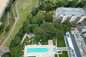 Ariel Footage of Attractive Tourist Destination at Bournemouth City Sandy Beach and Ocean of England Great Britain, Aerial Footage Captured with Drone's Camera on August 23rd, 2023 During sunny Day. photo