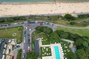 Ariel Footage of Attractive Tourist Destination at Bournemouth City Sandy Beach and Ocean of England Great Britain, Aerial Footage Captured with Drone's Camera on August 23rd, 2023 During sunny Day. photo